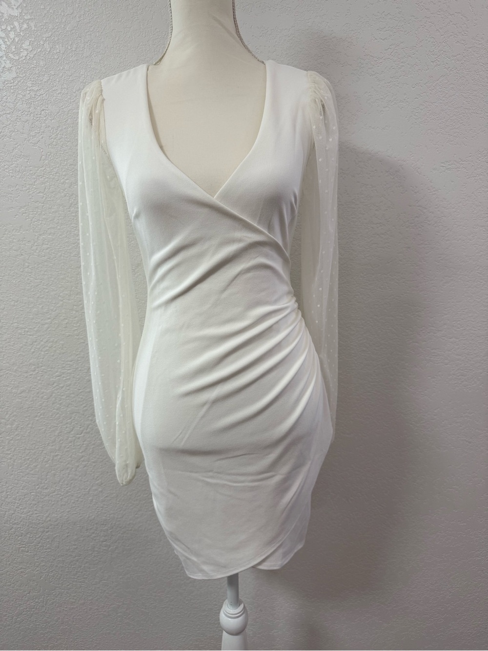 Elegant White Wrap-Style Dress with Sheer Dot Sleeve